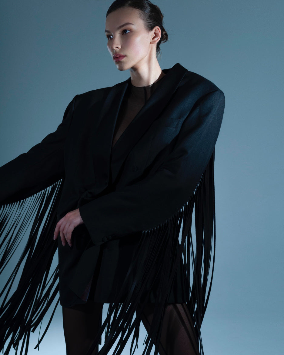 UPCYCLED JACKET WITH FRINGE with a man's shoulder