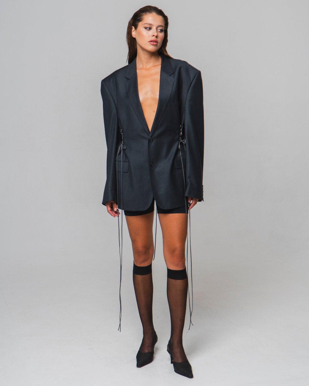 UPCYCLED JACKET with adjustable drawstrings with a man's shoulder