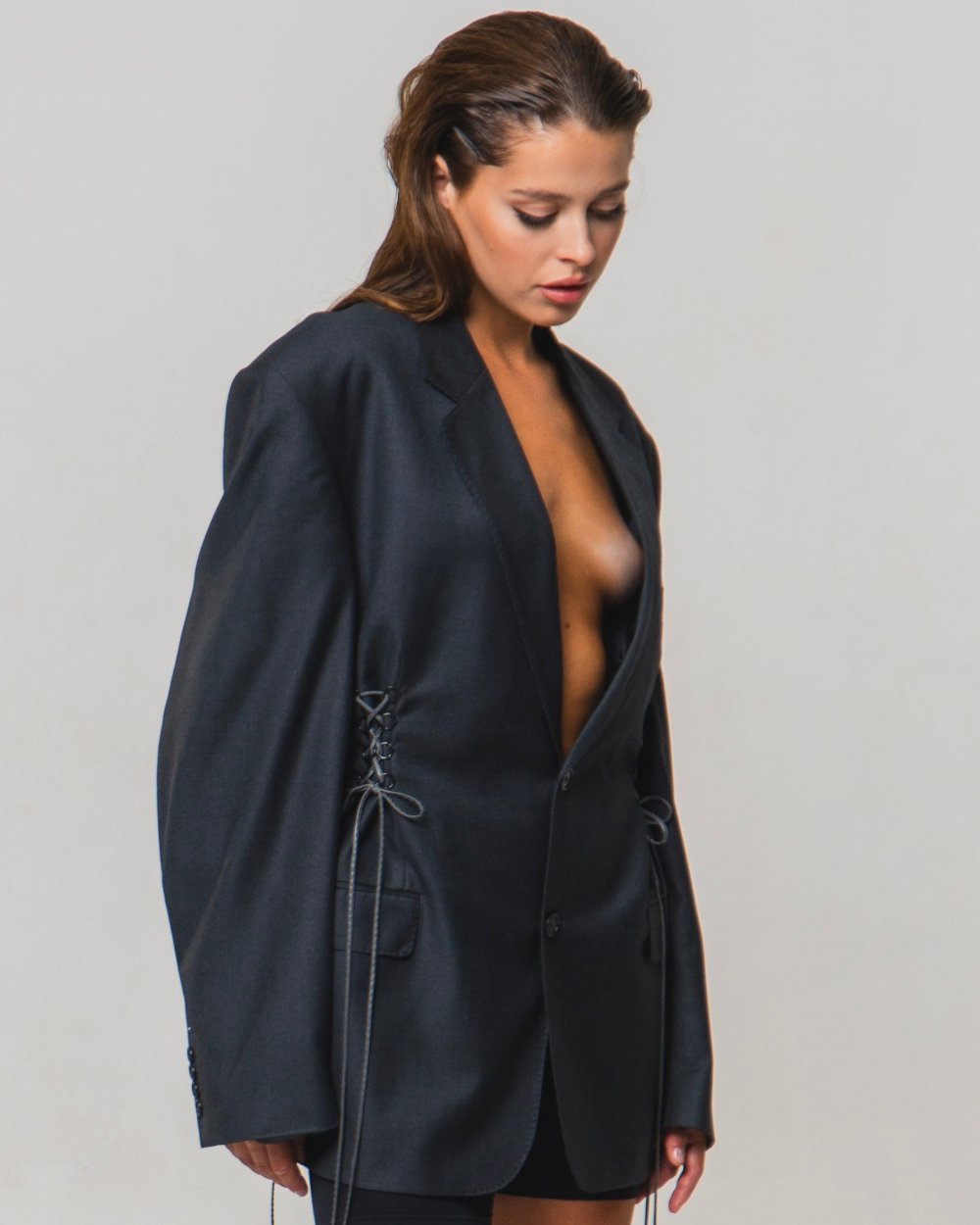 UPCYCLED JACKET with adjustable drawstrings with a man's shoulder