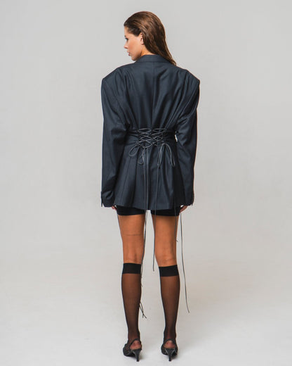 UPCYCLED JACKET with adjustable drawstrings with a man's shoulder