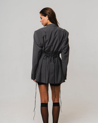 UPCYCLED JACKET with adjustable drawstrings with a man's shoulder