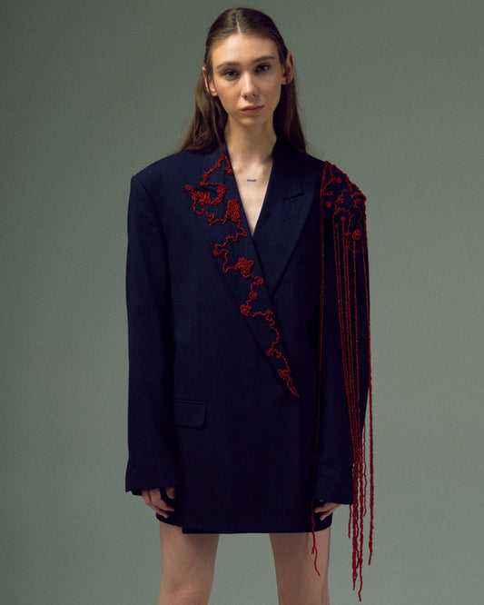 BEADED UPCYCLED JACKET with a man's shoulder